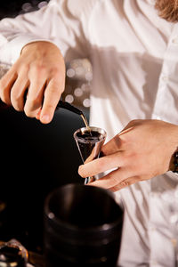 Midsection of man preparing food