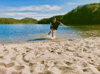 My children playing in the water at the beach