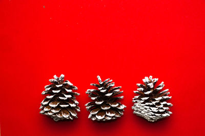 Close-up of christmas decoration on red table