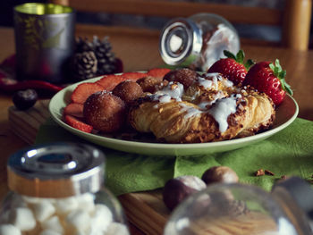 Close-up of fruits in plate on table