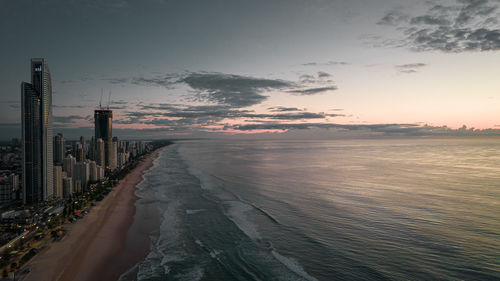 Scenic view of beach against sky during sunset