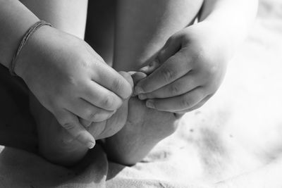 Child touching her feet