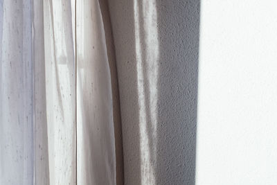 White curtain by wall