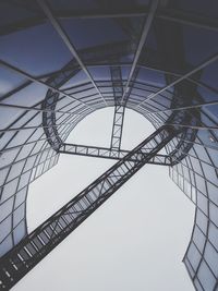 Low angle view of grid structure against sky