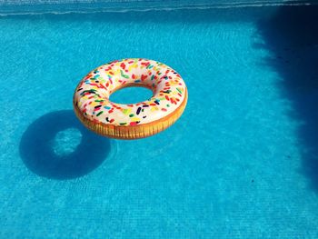 High angle view of chocolate floating on swimming pool