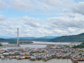 High angle view of bridge over river by buildings in city