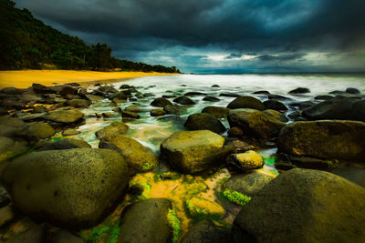 Scenic view of sea against cloudy sky