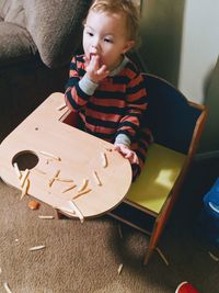 Cute boy sitting at home