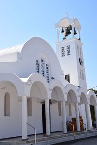 Low angle view of white building against sky