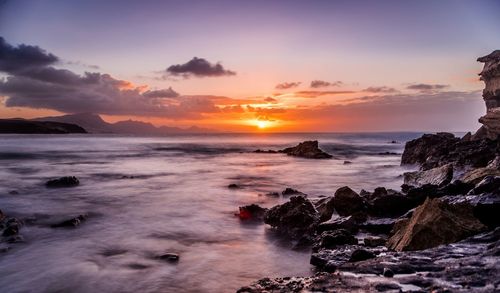 Scenic view of sea against sky during sunset