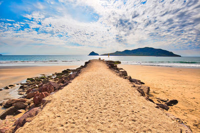 Scenic view of beach against sky