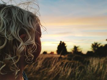Close-up of man on beach against sky