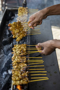 Cropped image of man preparing food