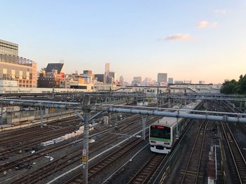 High angle view of train in city against sky
