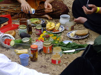 High angle view of people preparing food on table