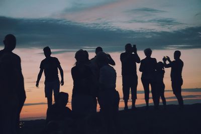 Silhouette people on beach