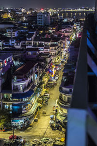 High angle view of illuminated cityscape at night