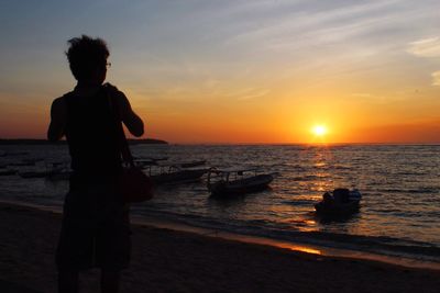 Scenic view of sea at sunset