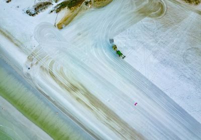 Aerial view of vehicle on frozen lake