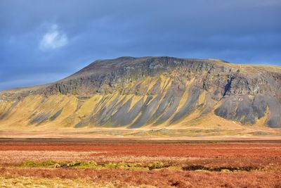 Scenic view of landscape and mountains against sky