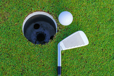 High angle view of golf equipment on grass