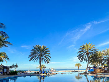 Outdoor swimming pool on the beach on coche island in venezuela at sunsol punta blanca