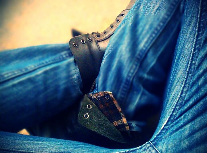 close-up, jeans, men, focus on foreground, part of, lifestyles, person, midsection, low section, casual clothing, indoors, selective focus, leisure activity, shoe, unrecognizable person, mid section, fashion