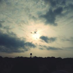 Low angle view of silhouette trees against sky at sunset