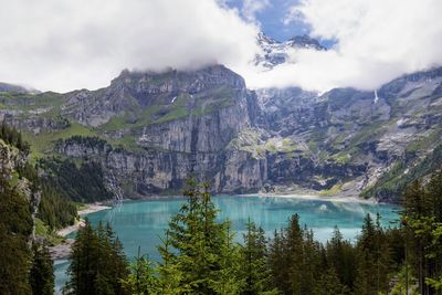 Scenic view of lake and mountains against sky