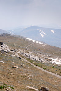 Scenic view of landscape and mountains against sky