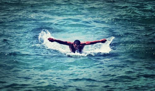 Man swimming in sea