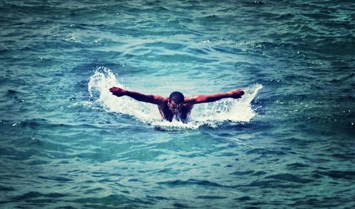 Man swimming in sea