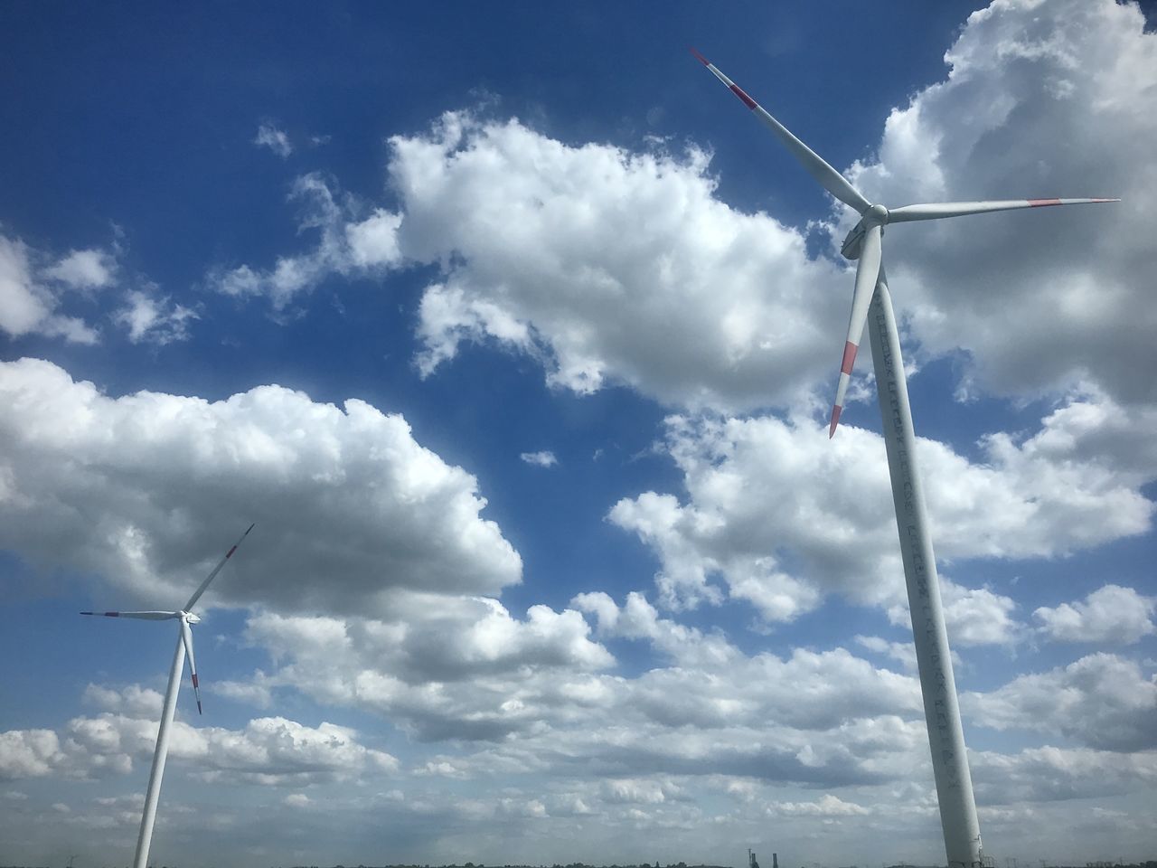 LOW ANGLE VIEW OF WINDMILLS AGAINST SKY