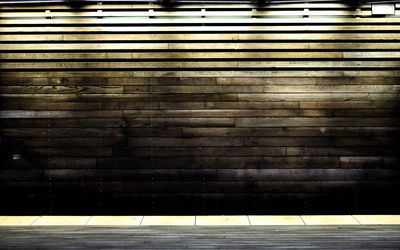 Illuminated wooden wall at night