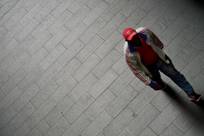 High angle view of woman walking on footpath