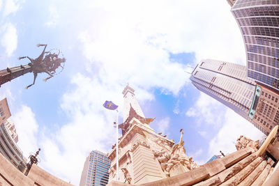 Low angle view of buildings in city against sky