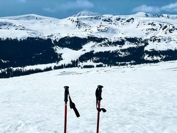 Scenic view of snow covered field against mountain