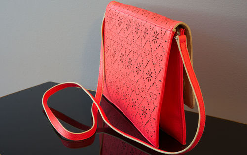 Close-up of sunglasses on table against wall