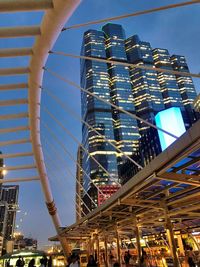 Low angle view of illuminated buildings against sky