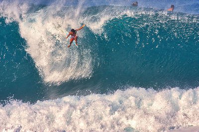 High angle view of man surfing in sea