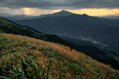 Scenic view of mountains against sky during sunset