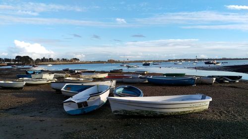 View of harbor against cloudy sky