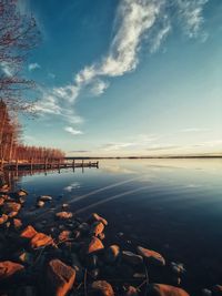 Scenic view of lake against sky during sunset