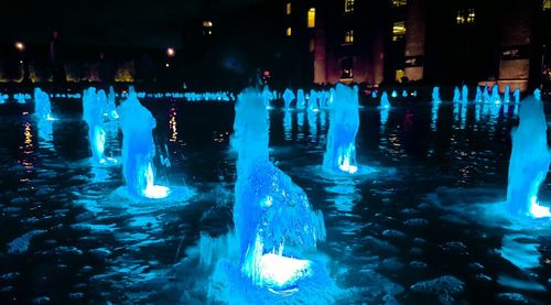 Panoramic view of illuminated water at night