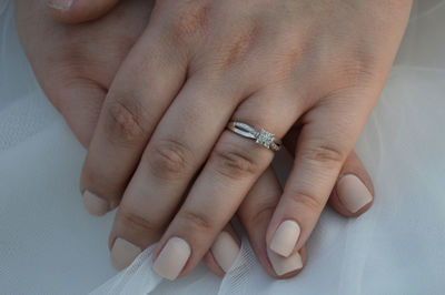 Midsection of bride with wedding ring