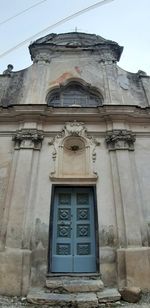 Low angle view of closed door of building