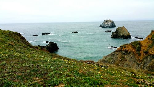 Diagonal cliff edge framing ocean waters below