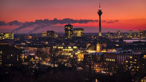 Illuminated buildings in city at night