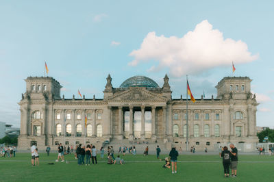 People in front of historic building