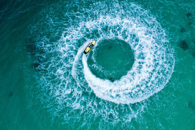 High angle view of man swimming in sea